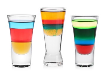 Different shooters in shot glasses isolated on white, set