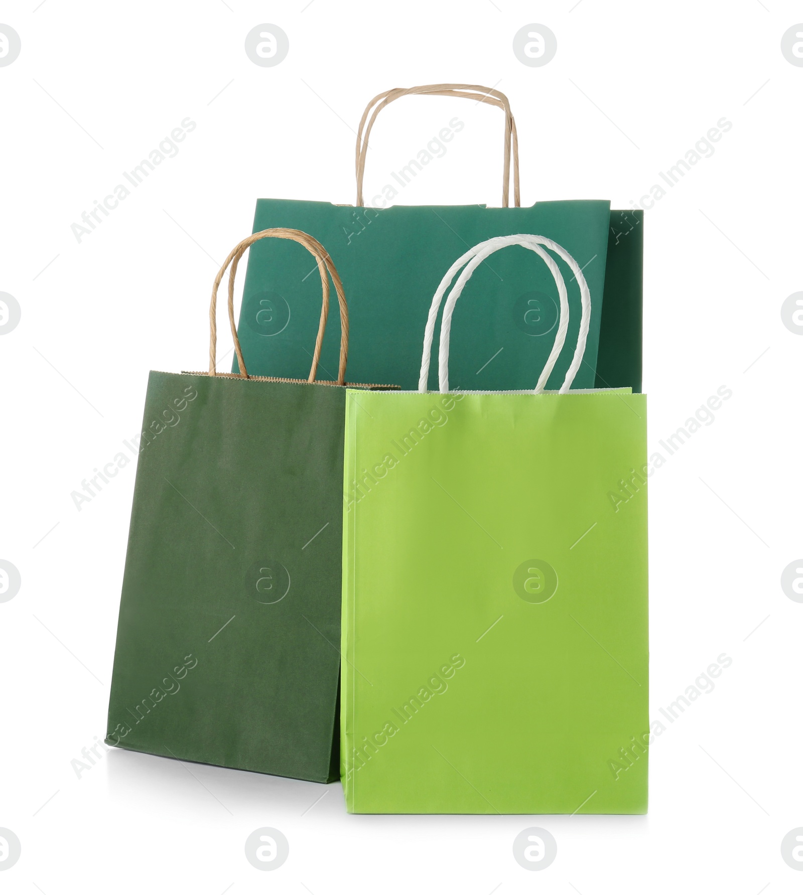 Photo of Mockup of paper shopping bags on white background