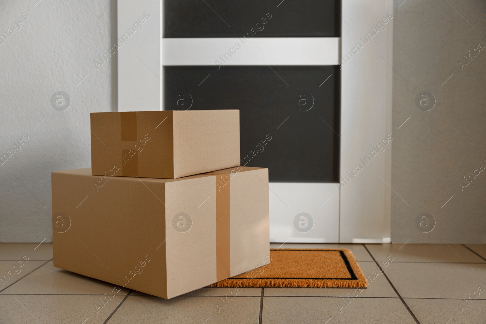 Photo of Parcels delivered on mat near front door