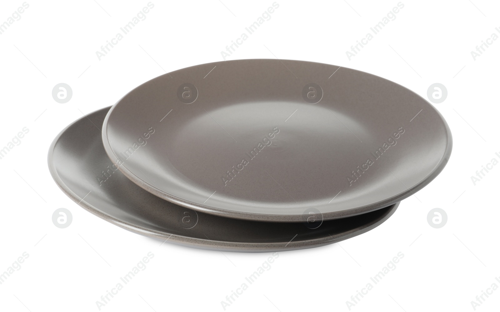 Photo of New grey ceramic plates isolated on white