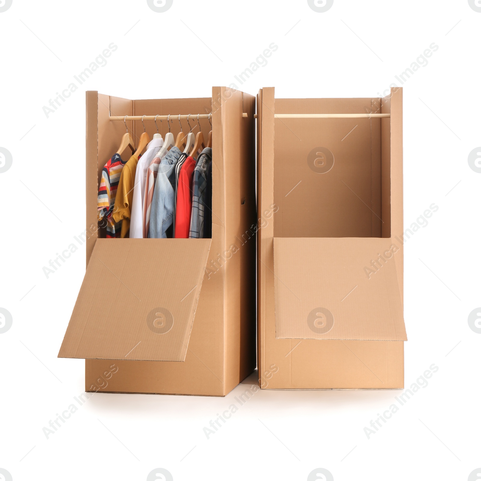 Photo of Cardboard wardrobe boxes with clothes on white background