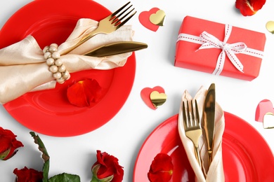 Photo of Beautiful table setting for romantic dinner on white background, flat lay. Valentine's day celebration