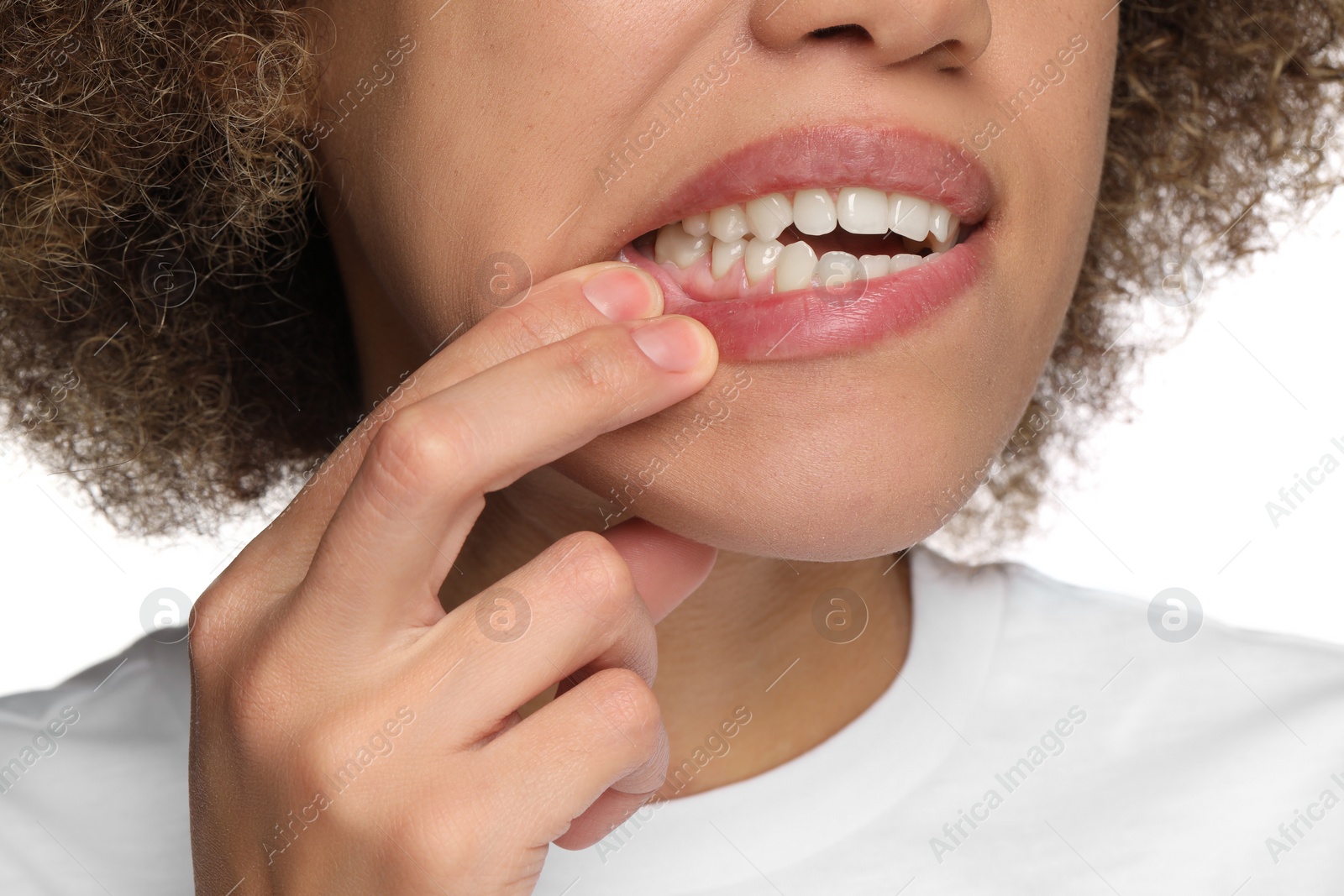 Photo of Woman showing her clean teeth on white background, closeup