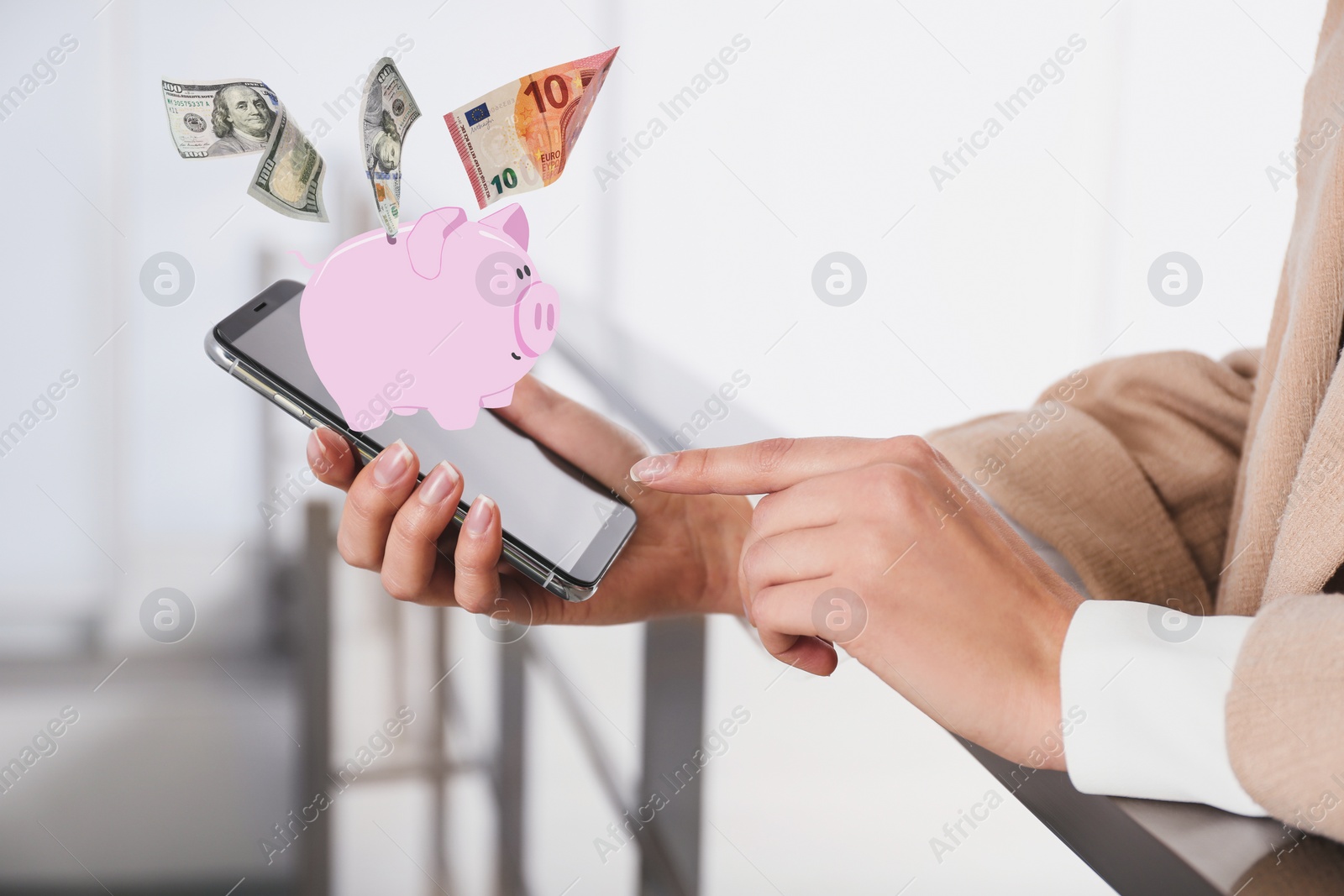 Image of Woman using online bank application on her smartphone indoors