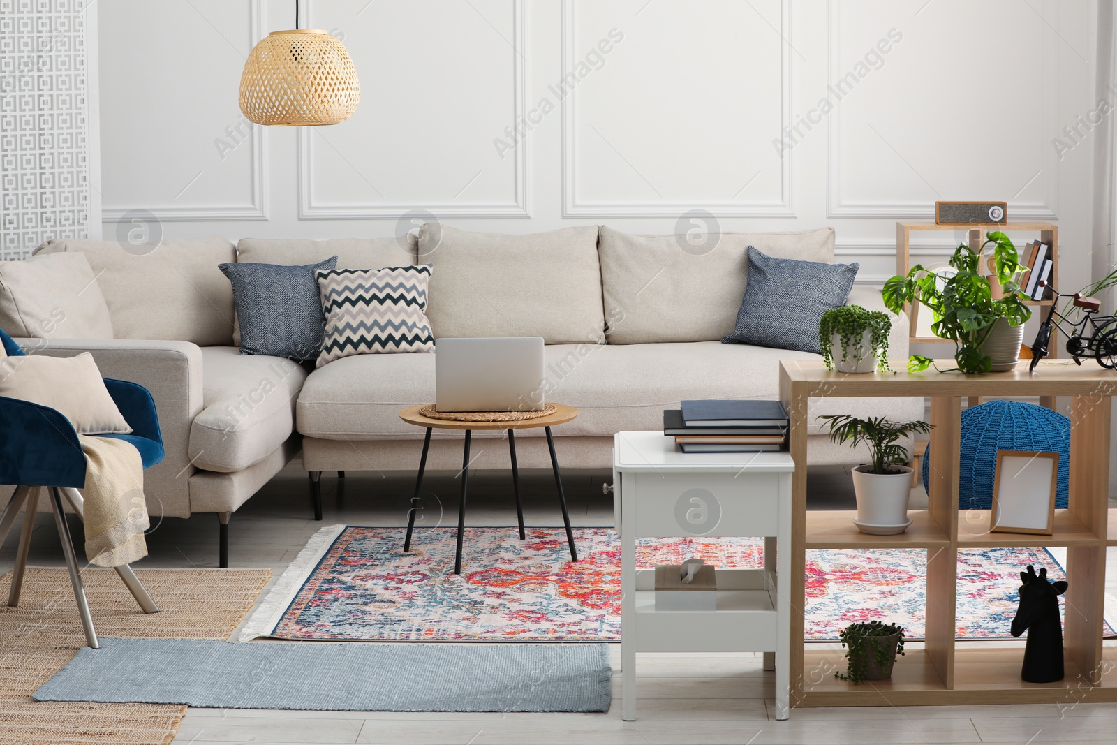 Photo of Stylish living room with beautiful carpet and modern furniture. Interior design