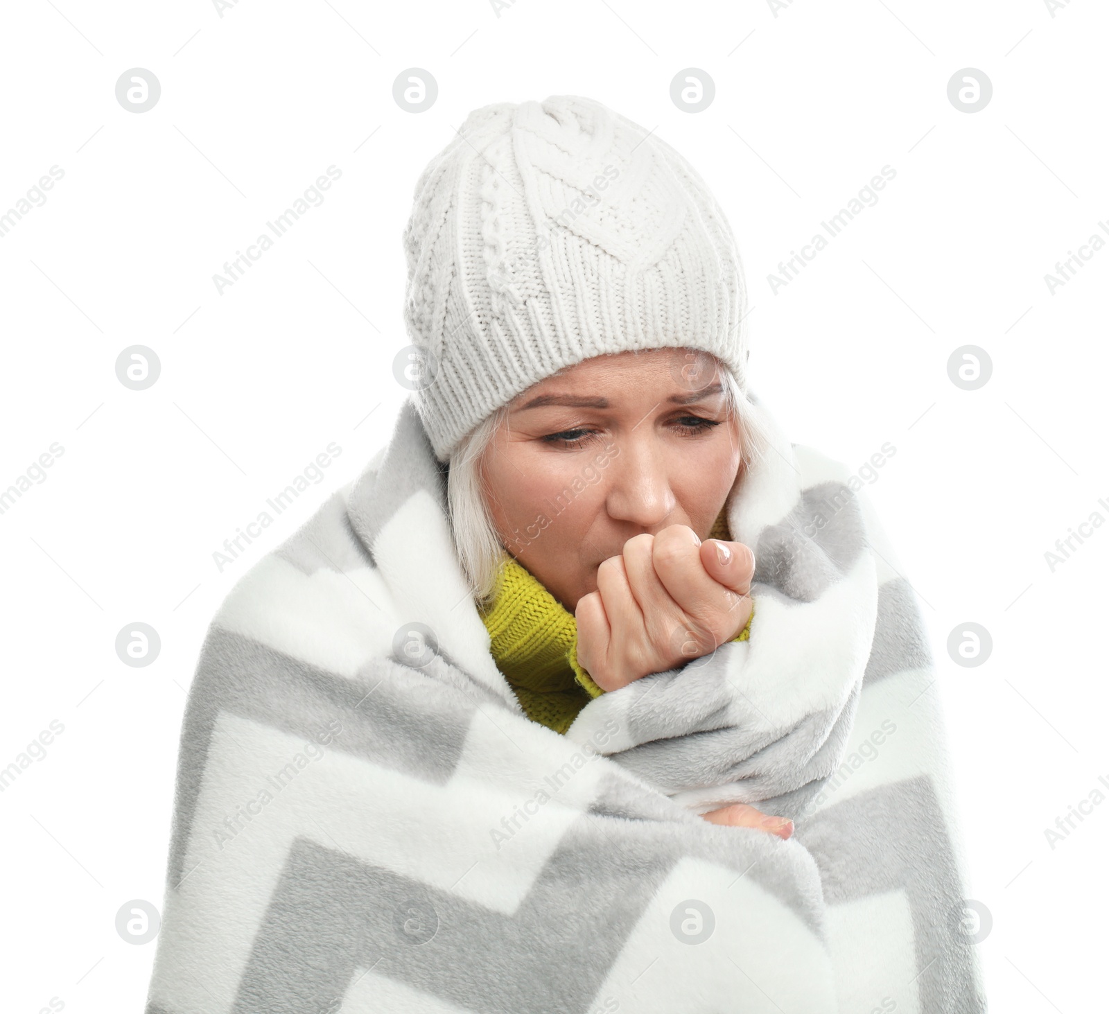 Photo of Mature woman wrapped in warm blanket suffering from cold on white background