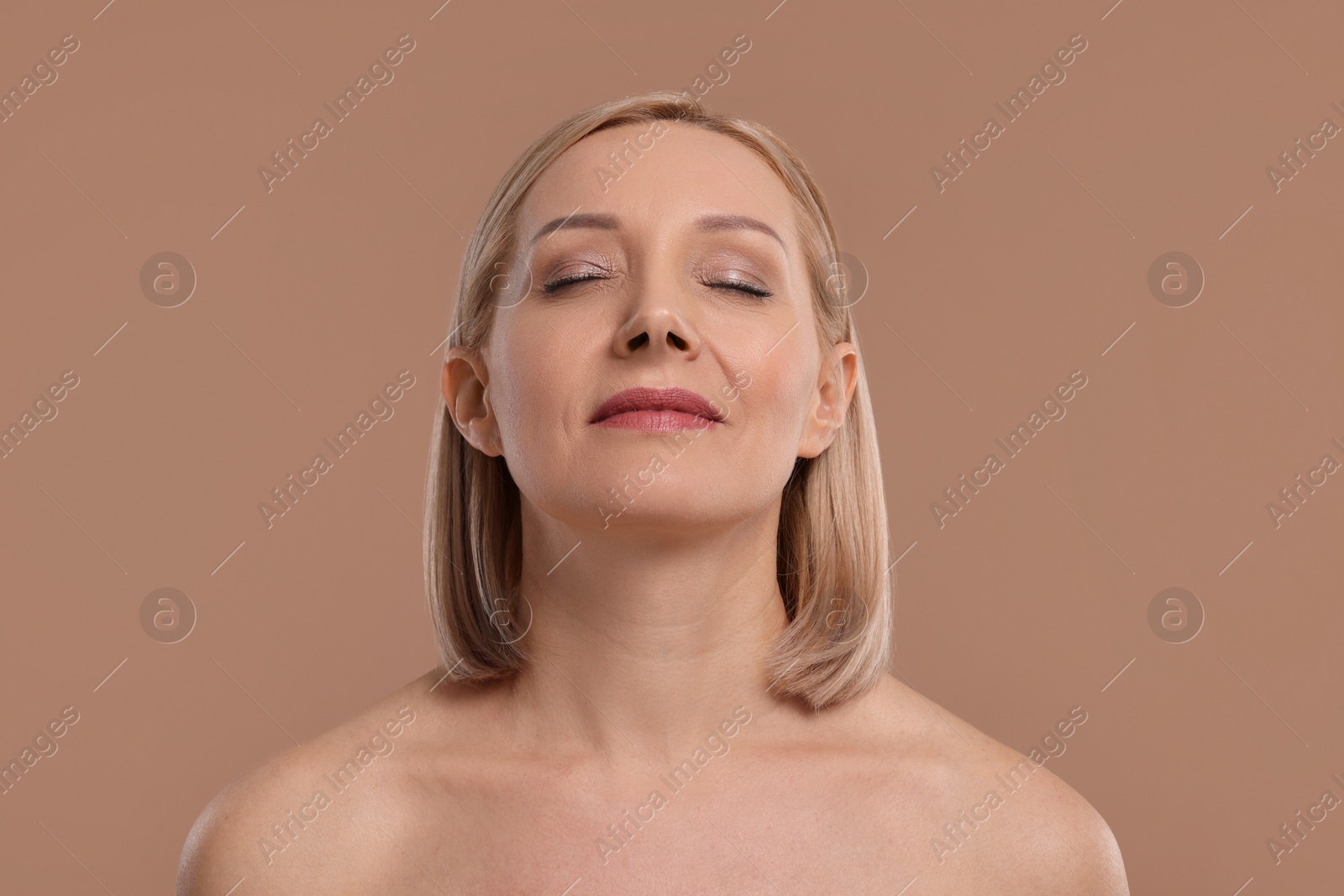 Photo of Beautiful woman with healthy skin on beige background