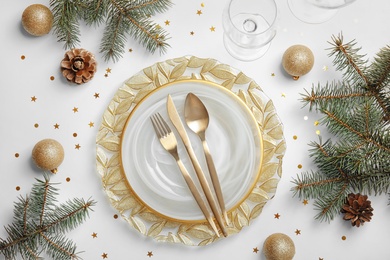 Photo of Elegant table setting on light background, top view. Christmas celebration