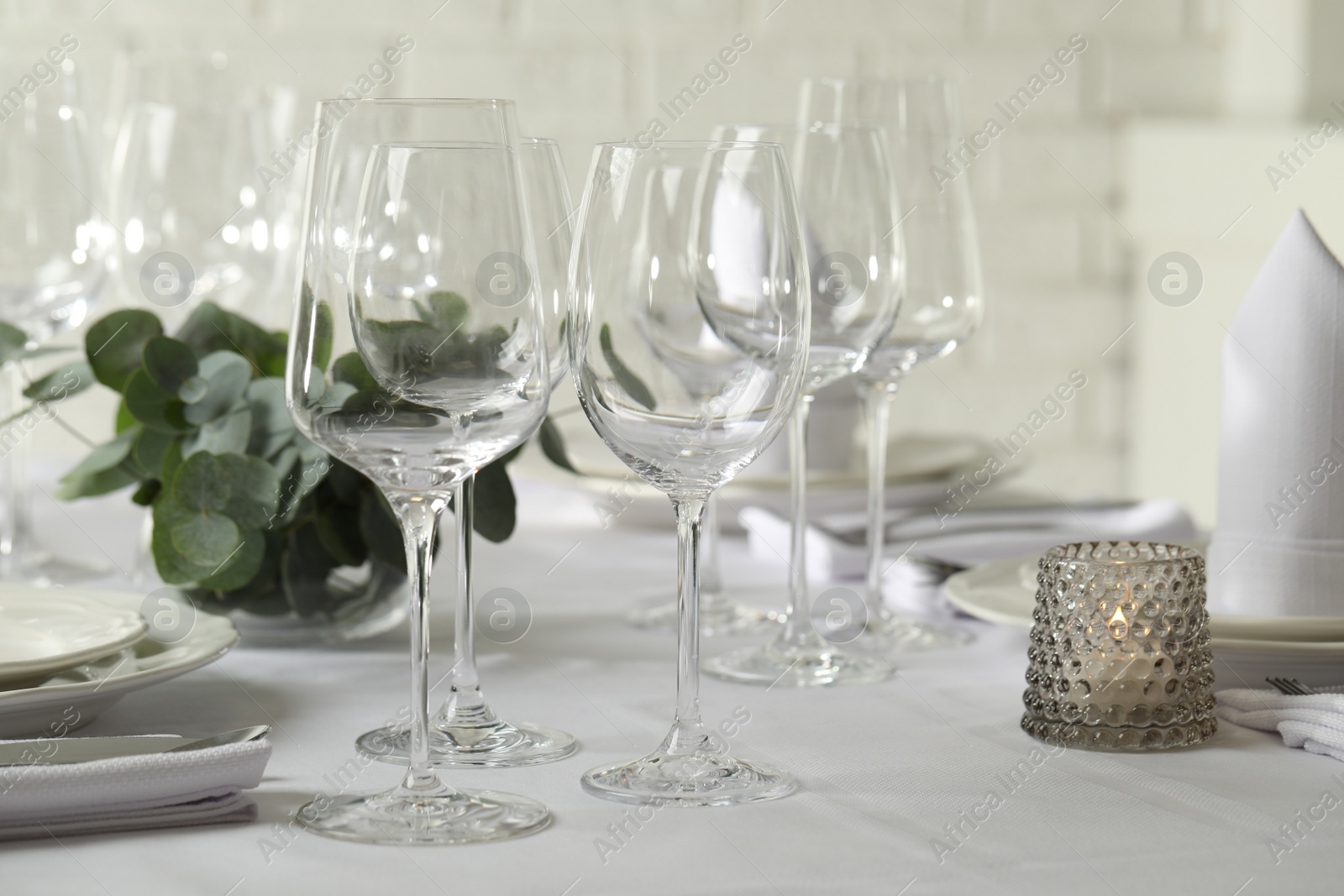 Photo of Stylish elegant table setting for festive dinner in restaurant