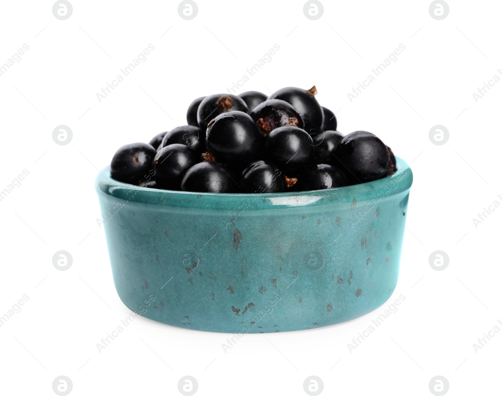 Photo of Ripe blackcurrants in bowl isolated on white