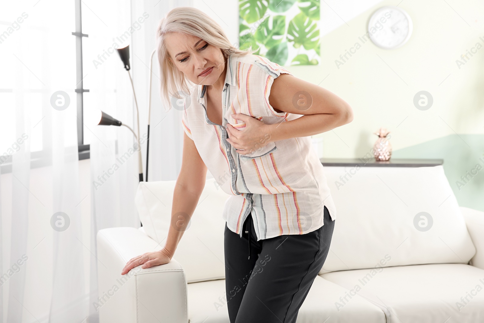 Photo of Mature woman having heart attack at home