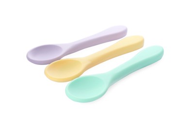 Photo of Plastic spoons on white background. Serving baby food