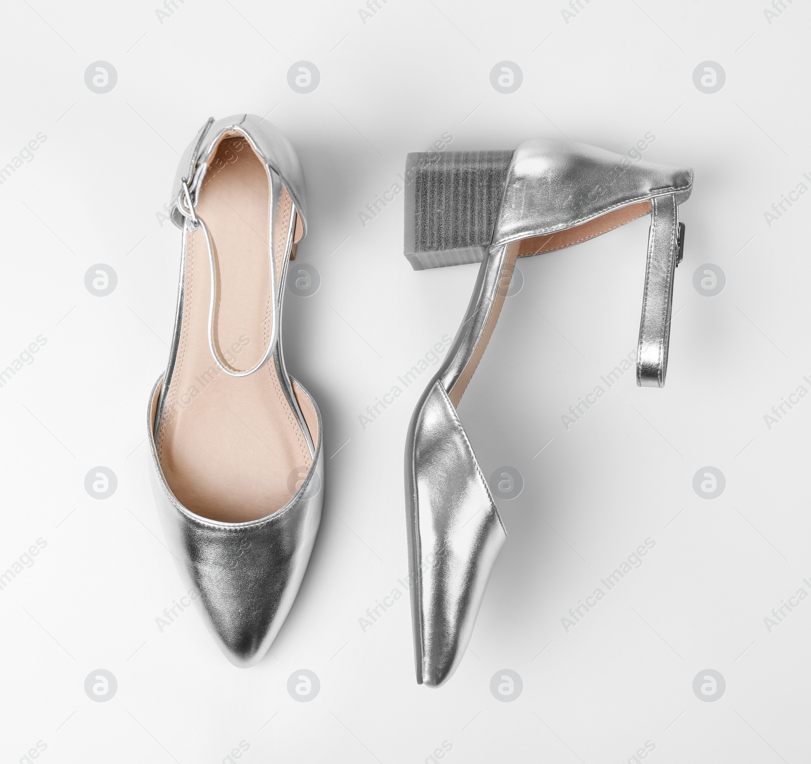 Photo of Pair of female shoes on white background, top view