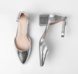 Photo of Pair of female shoes on white background, top view