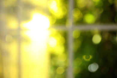 Photo of Blurred view through window on garden in morning