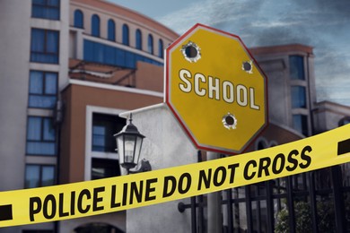 Yellow crime scene tape blocking way to school