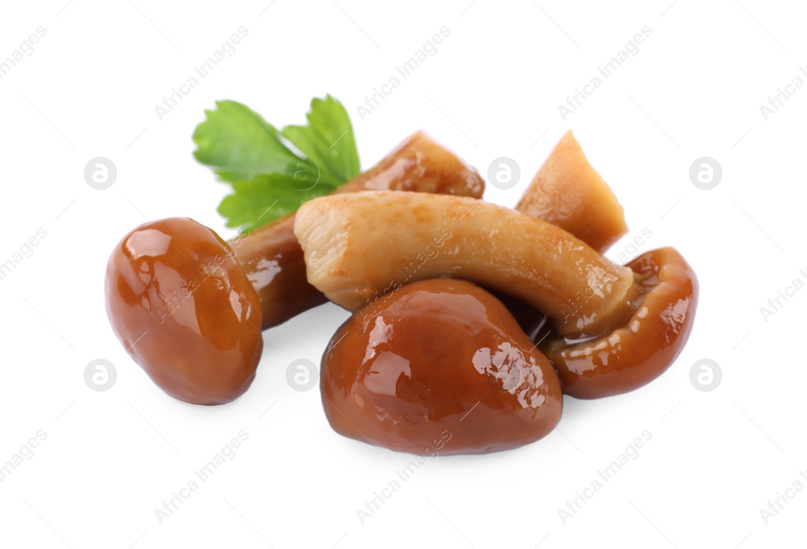 Photo of Delicious marinated mushrooms with parsley isolated on white