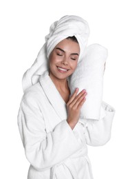 Photo of Beautiful young woman wearing bathrobe with towels against white background