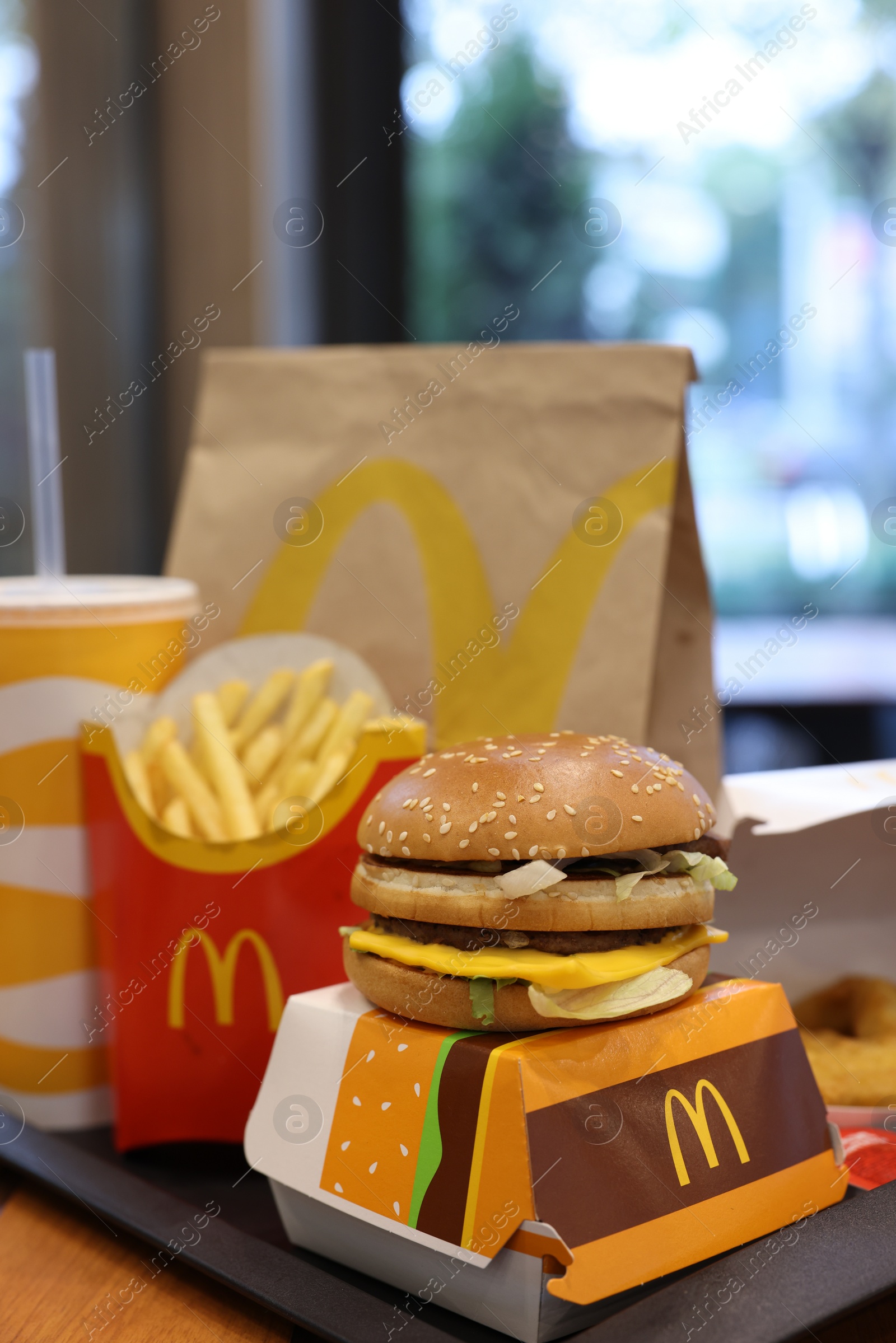 Photo of Lviv, Ukraine - October 9, 2023: McDonald's menu on wooden table in restaurant