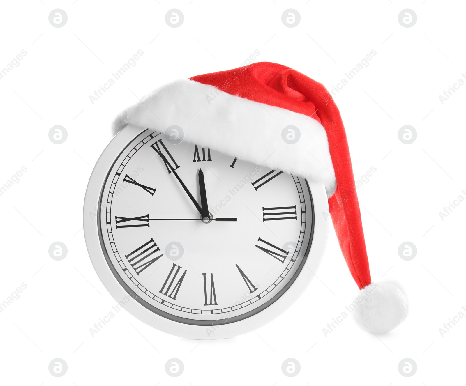 Photo of Clock with Santa hat showing five minutes until midnight on white background. New Year countdown