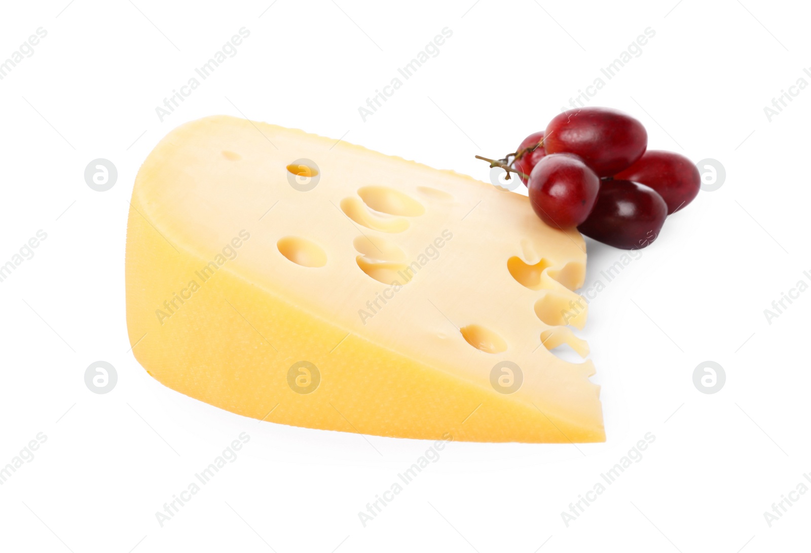 Photo of Piece of delicious cheese and grapes isolated on white