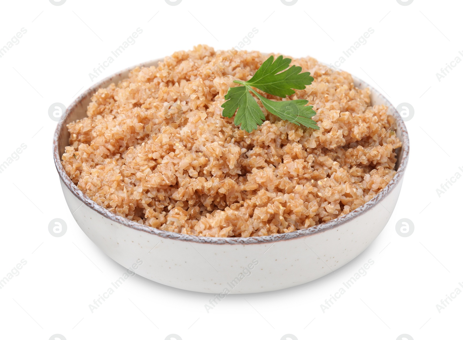 Photo of Tasty wheat porridge with parsley in bowl isolated on white