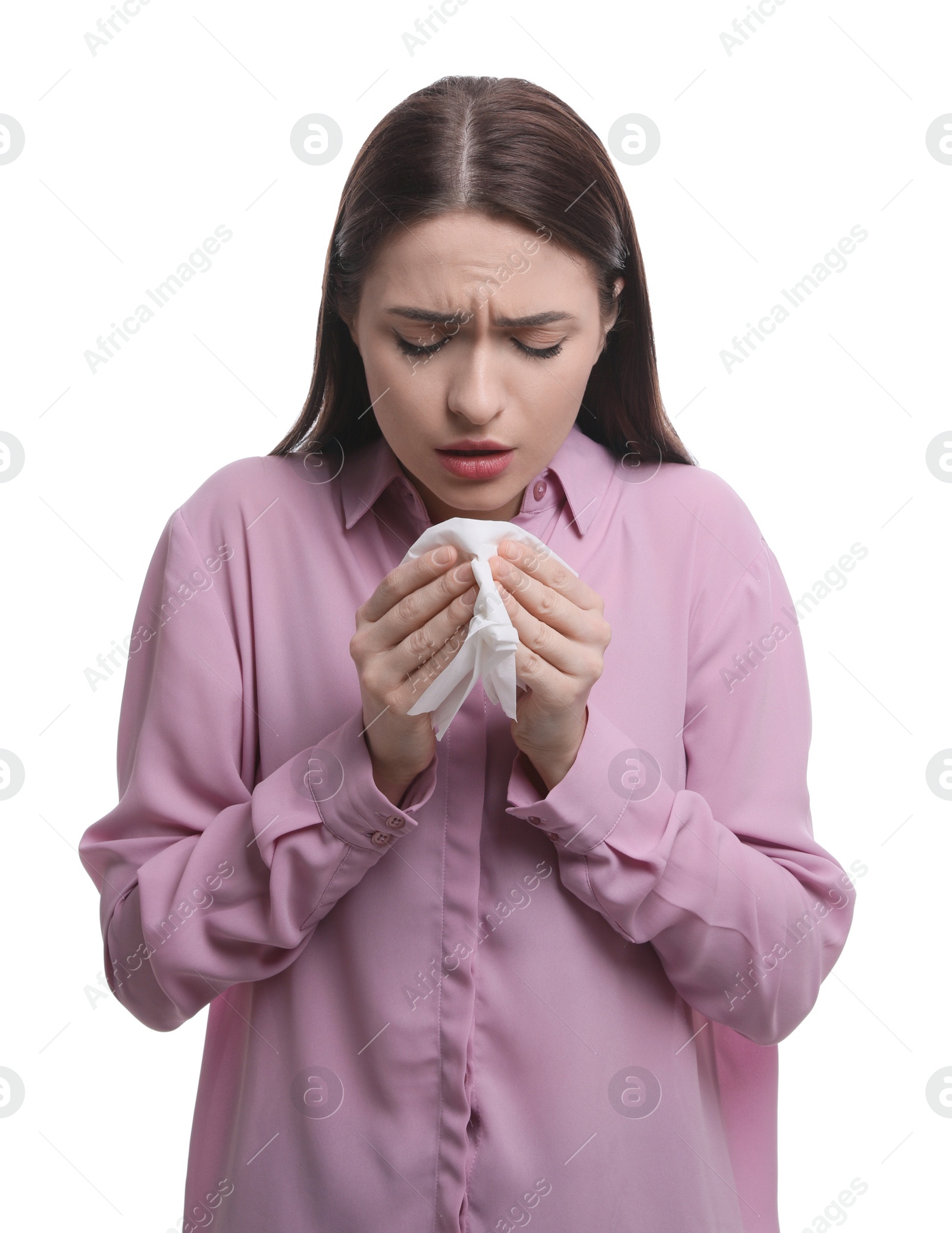 Photo of Sick woman sneezing on white background. Cold symptoms