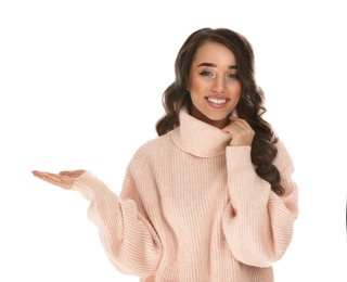 Photo of Beautiful young woman wearing warm sweater on white background. Christmas party