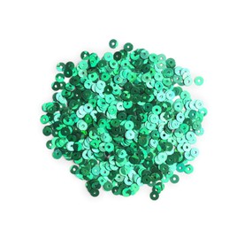Photo of Pile of green sequins isolated on white, top view
