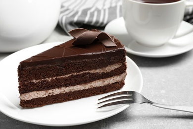 Photo of Delicious fresh chocolate cake served on table, closeup