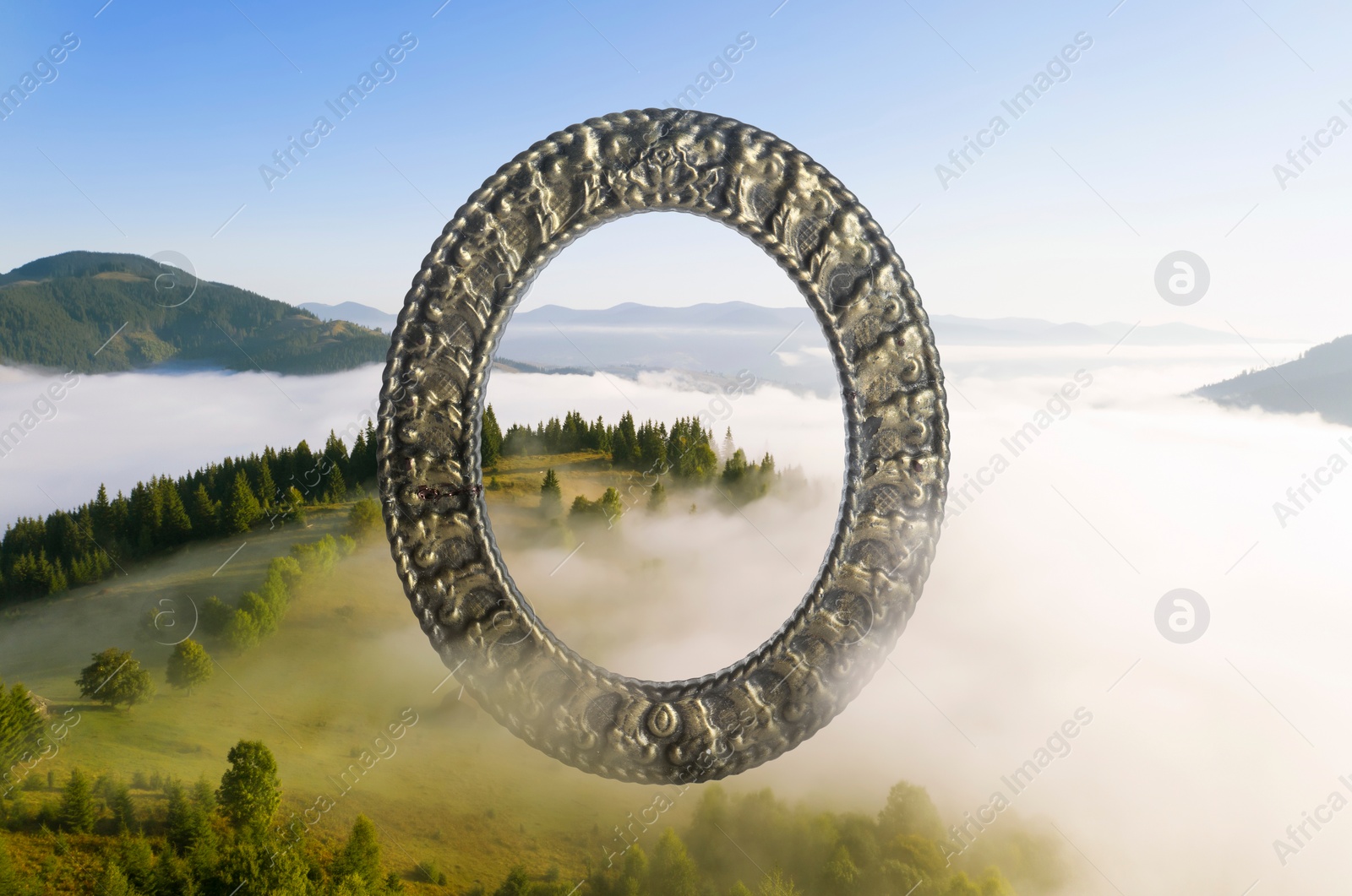 Image of Vintage frame and beautiful mountains covered with fog in morning