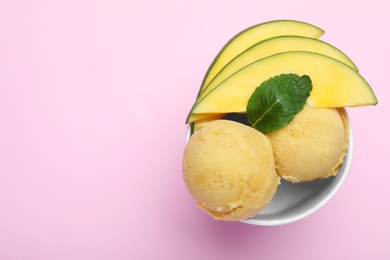 Delicious mango ice cream on pink background, top view. Space for text