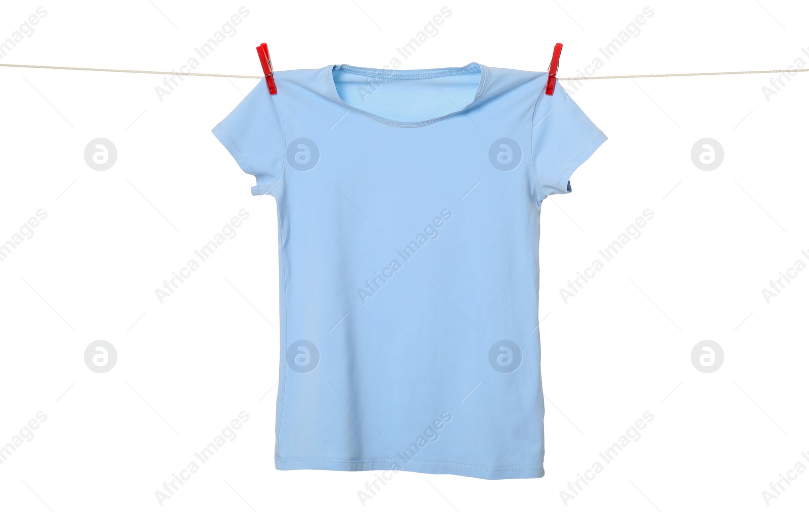 Photo of One light blue t-shirt drying on washing line isolated on white
