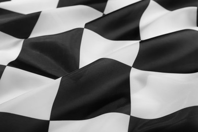 Photo of Checkered finish flag as background, closeup view