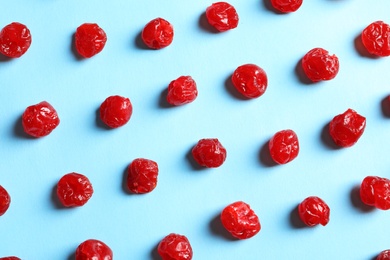 Photo of Flat lay composition of cherries on color background. Dried fruit as healthy snack