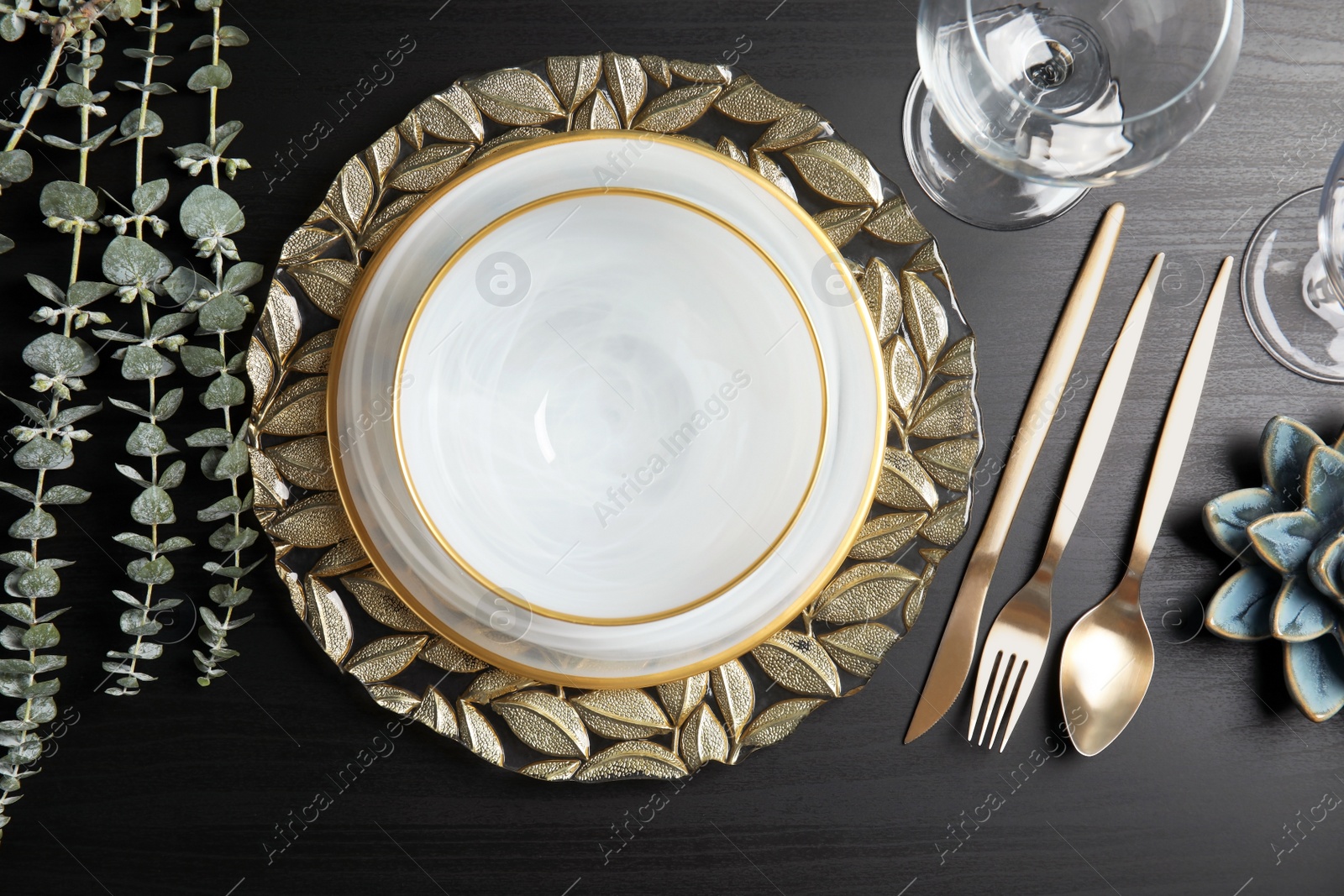 Photo of Elegant table setting on dark background, top view