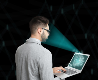 Image of Facial recognition system. Man using laptop on color background 
