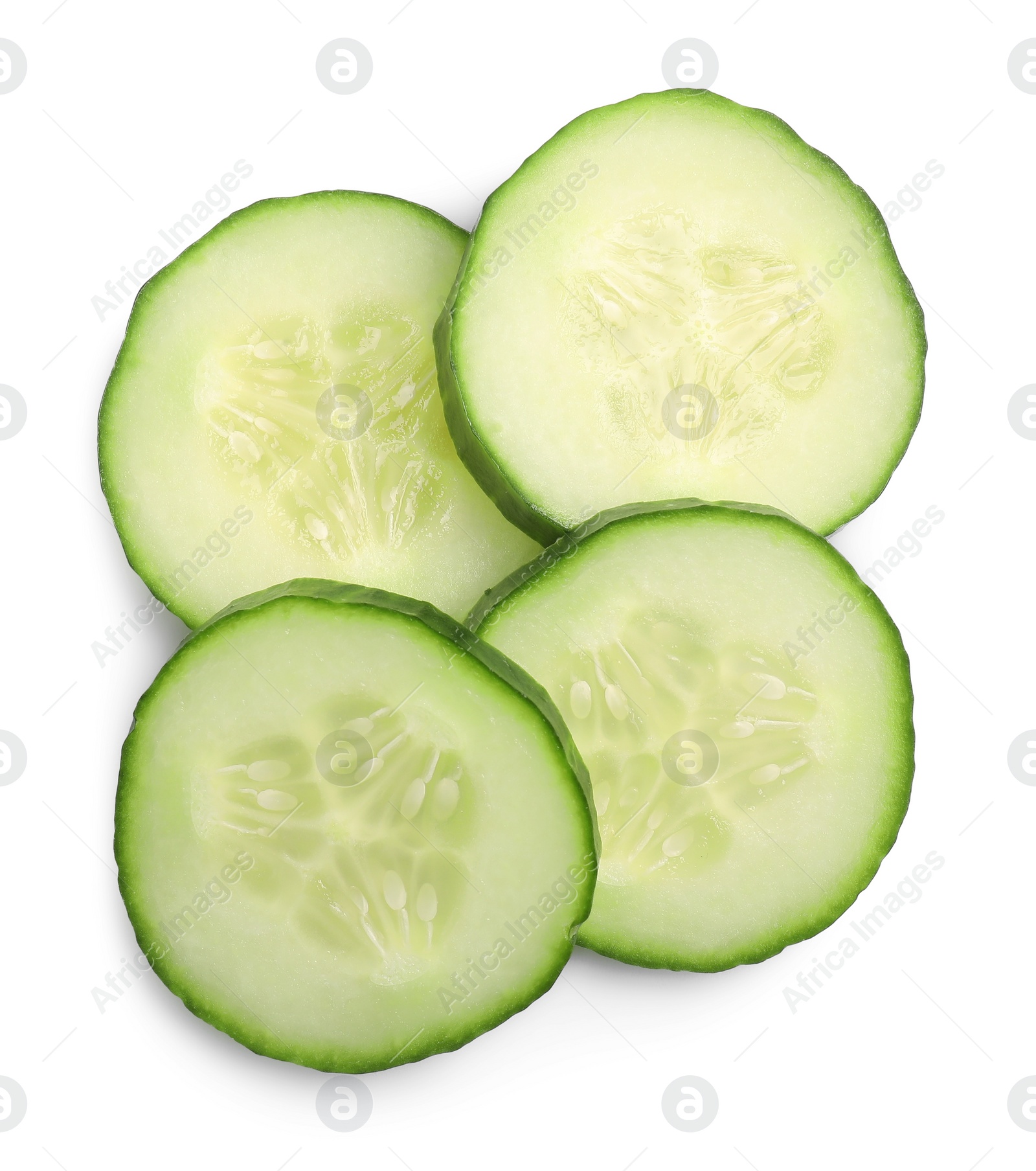 Photo of Slices of fresh cucumber isolated on white, above view