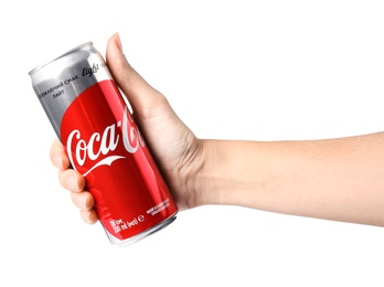 Photo of MYKOLAIV, UKRAINE - NOVEMBER 15, 2018: Woman holding Coca Cola can on white background, closeup