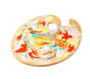 Photo of Wooden artist's palette with mixed paints isolated on white