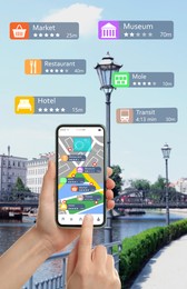 Image of Tourist using online guide application on smartphone for navigation in city, closeup 