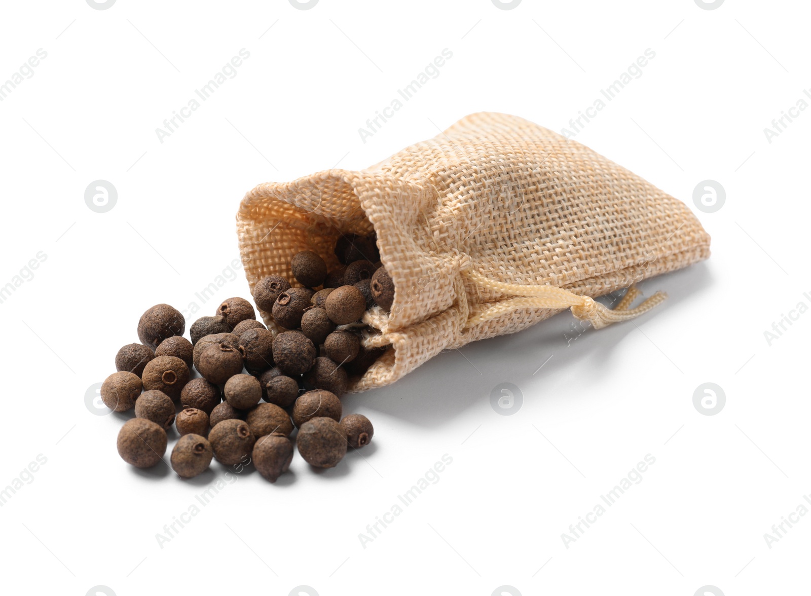 Photo of Dry allspice berries (Jamaica pepper) in bag isolated on white