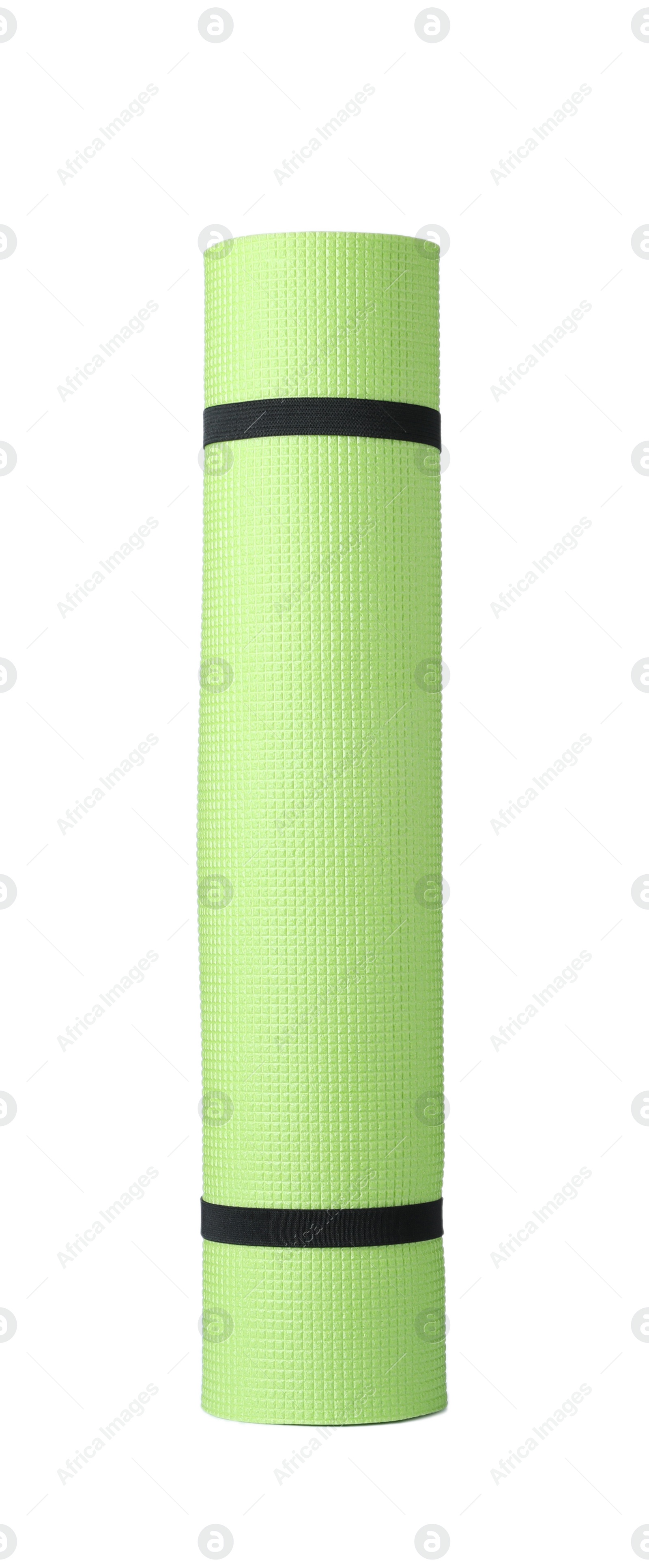 Photo of Rolled light green camping mat isolated on white