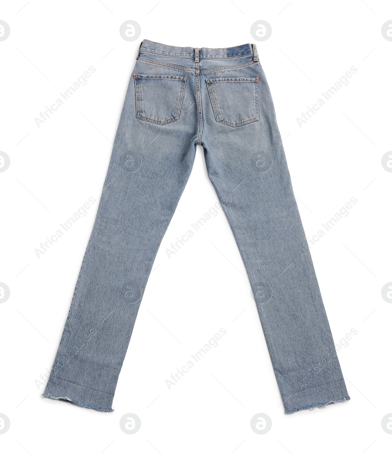 Photo of Light blue jeans isolated on white, top view. Stylish clothes