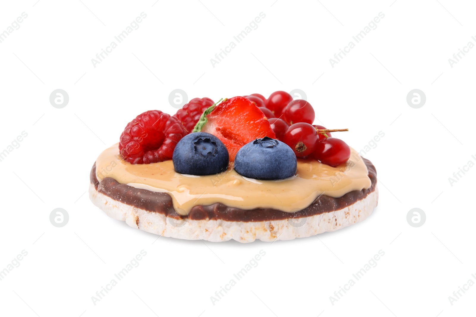 Photo of Crunchy rice cake with peanut butter and sweet berries isolated on white