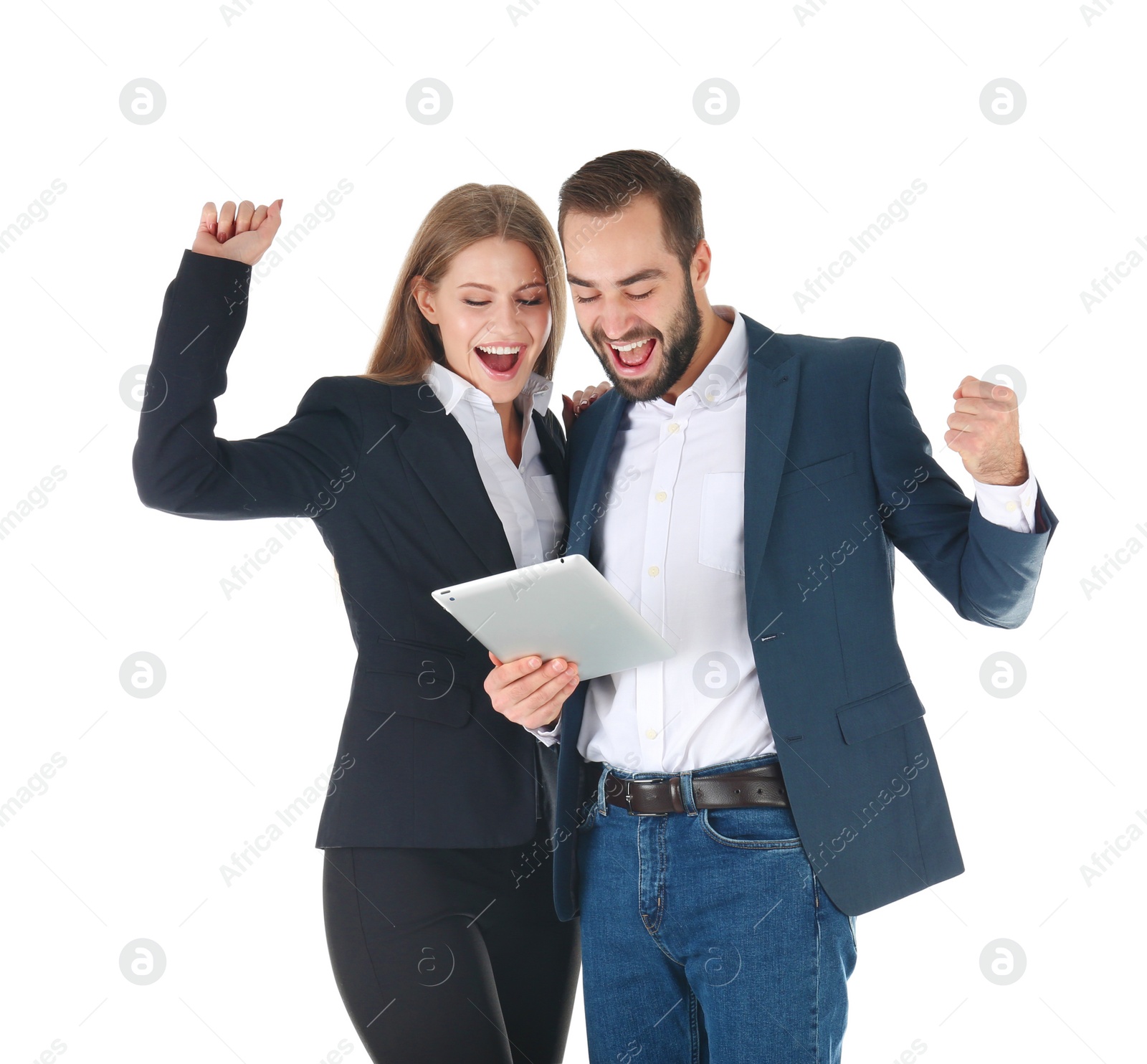 Photo of Emotional young people in office wear with tablet celebrating victory on white background