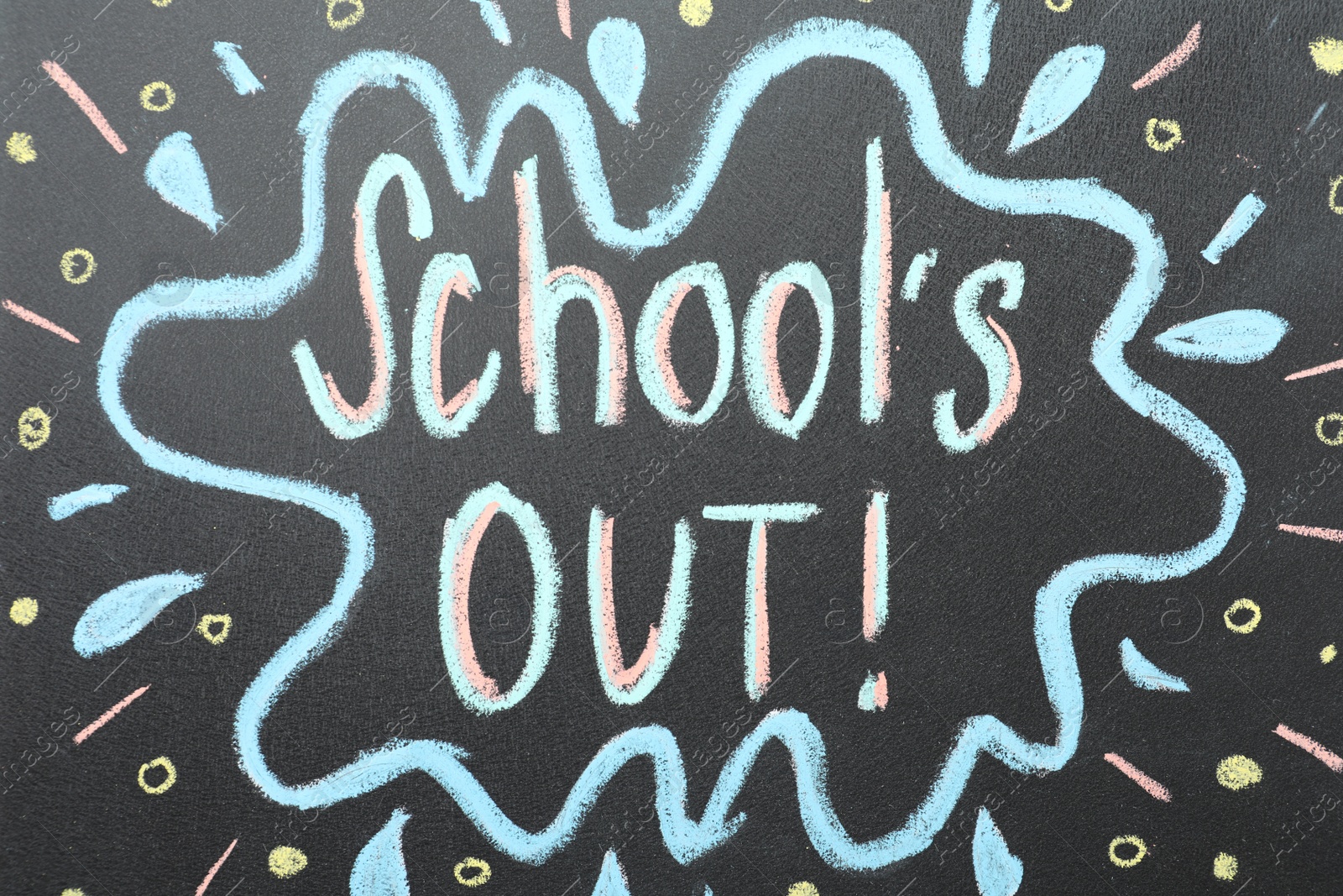 Photo of Text School's Out written on black chalkboard. Summer holidays