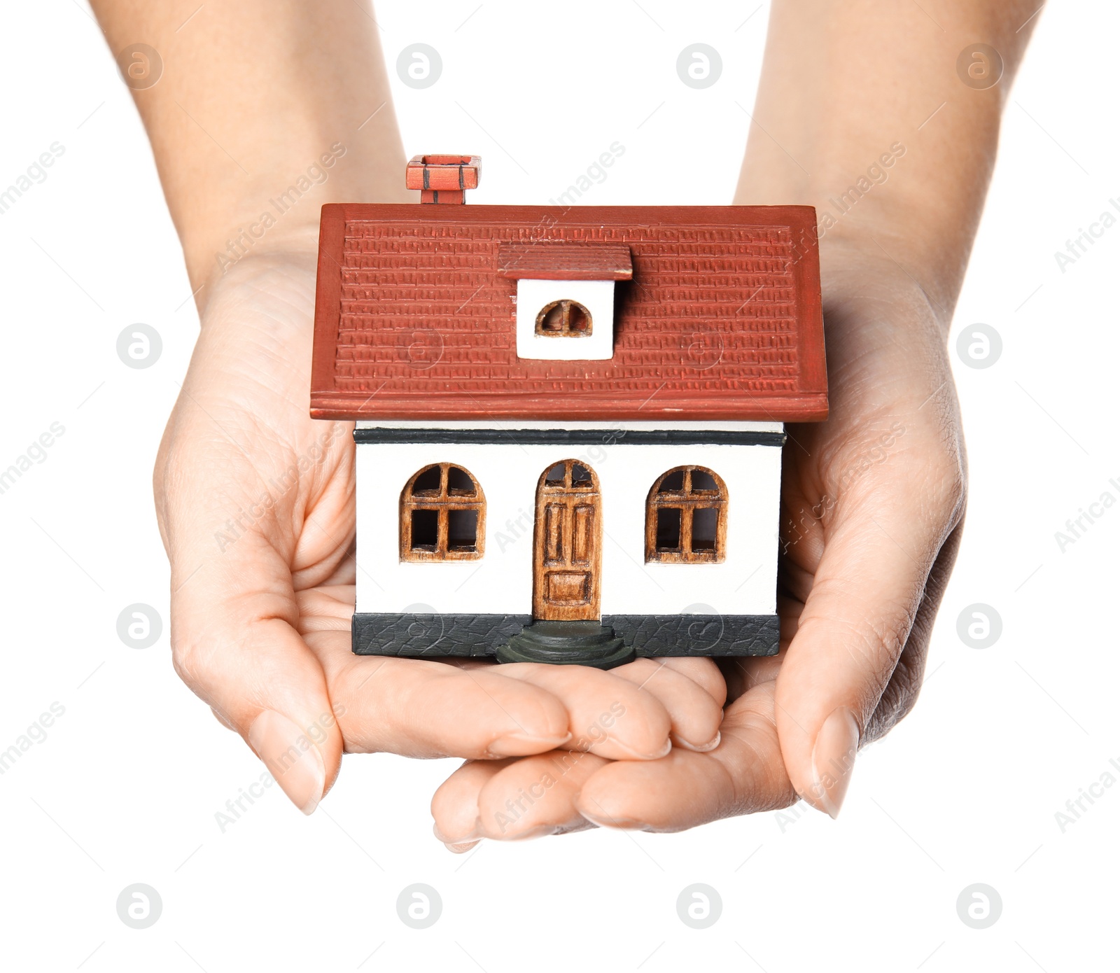 Photo of Woman holding house model in hands on white background