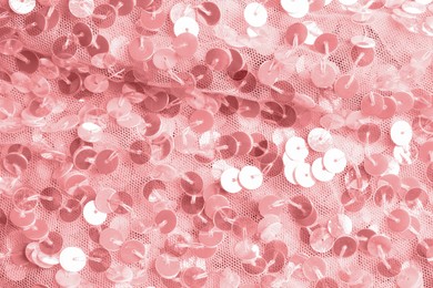 Photo of Beautiful pink fabric with shiny sequins as background, closeup