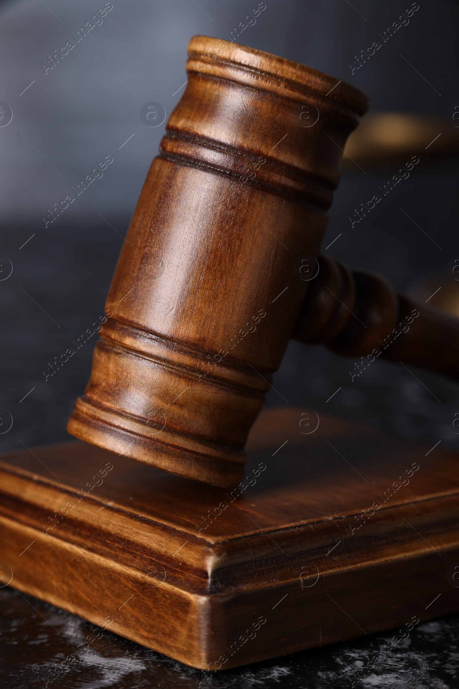 Photo of Law concept. Judge's gavel on dark table, closeup